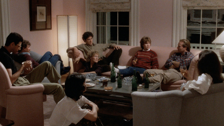 A group of friends hanging out in a living room in The Big Chill (1983)