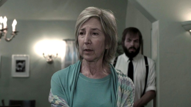 Elise Rainier speaking in a white room in Insidious