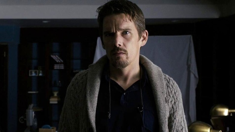 Ellison Oswalt wears a grey sweater in Sinister