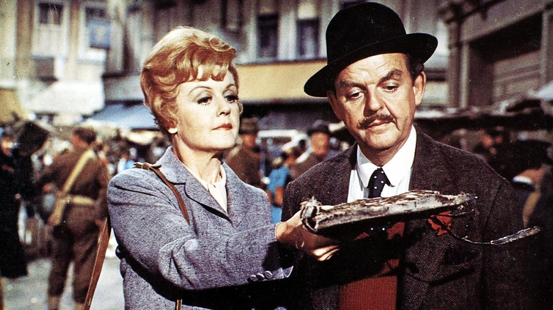 Miss Eglantine Price shows Mr. Browne a book of spells in "Bedknobs and Broomsticks" (1971)
