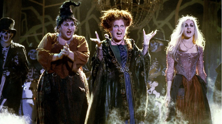 Winnie, Sarah, and Mary walk amongst trick or treaters in "Hocus Pocus" (1993)