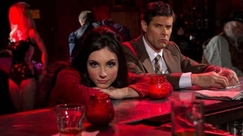 Elaine Parks sits in a bar in "The Love Witch" (2016)
