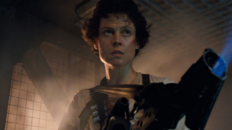 Ripley holds a flamethrower in Aliens
