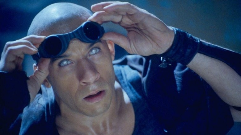 Riddick raises his goggles in Pitch Black