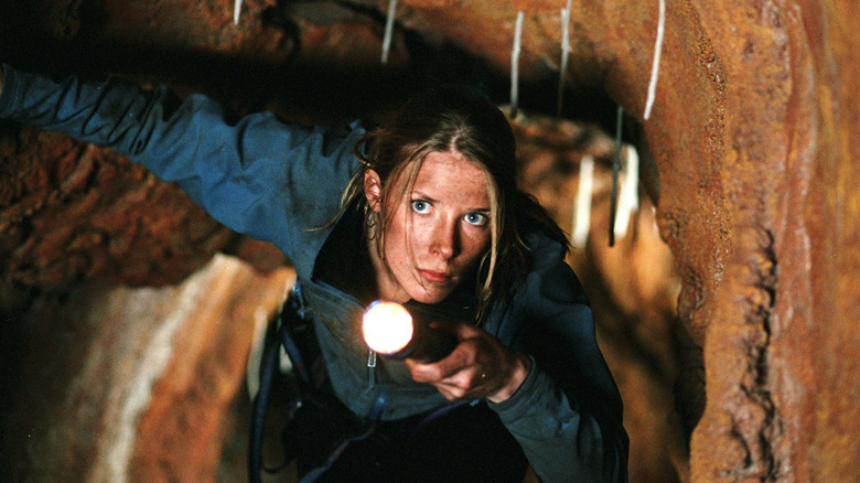 Sarah exploring cave in The Descent