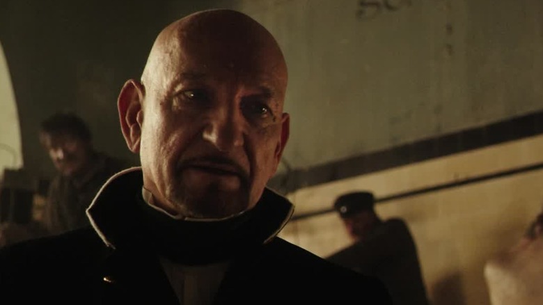 Dr. Lamb looking down at Dr. Newgate in "Stonehearst Asylum" (2014)