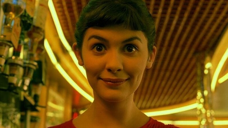 Amélie smiling at the camera in Amélie (2001)