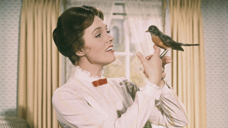 Mary smiling at a bird in Mary Poppins (1964)