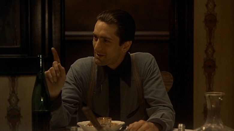 Vito Corleone with his finger raised in The Godfather Part II