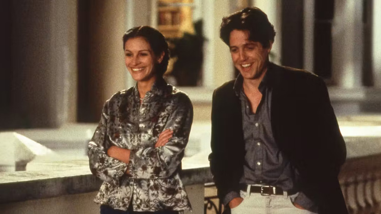 Anna and Will walking down a London street in Notting Hill
