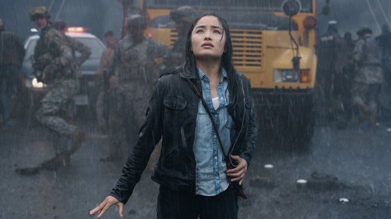 Cate looks up into the rain in Monarch: Legacy of Monsters