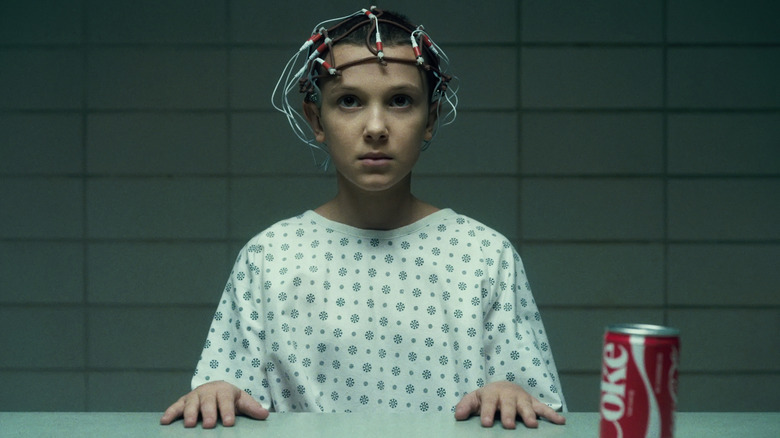 Eleven wearing electrodes in Stranger Things