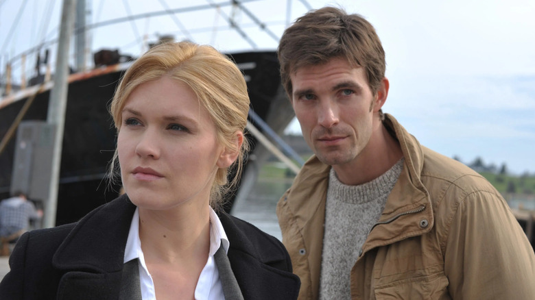 Audrey and Nathan stand on the dock in Haven.