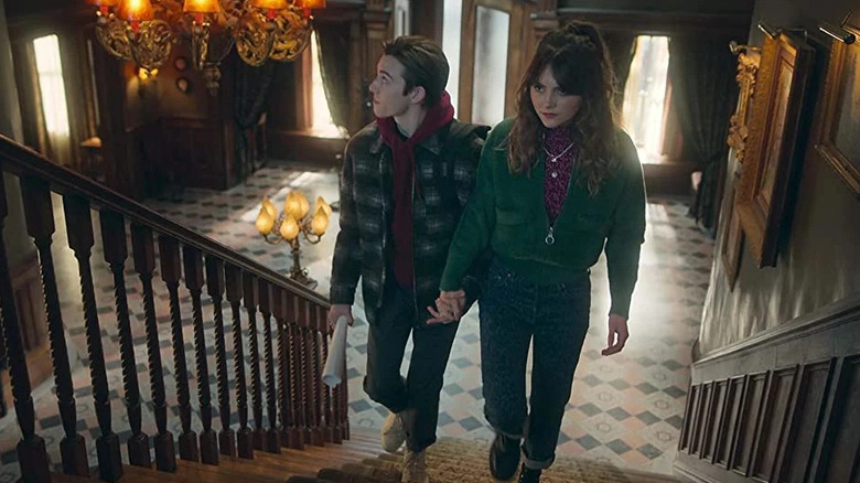 Kinsey and Connor walk up the stairs in Locke & Key