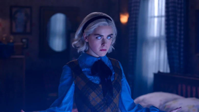 Sabrina's eyes turn white as she begins to use her powers in The Chilling Adventures of Sabrina.