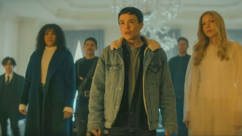 Viktor leads a group of heroes in a fancy ballroom in The Umbrella Academy.