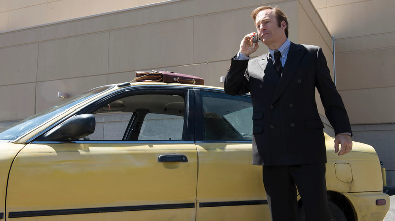 Saul walks past his car on the phone in "Better Call Saul" (2015-2022)