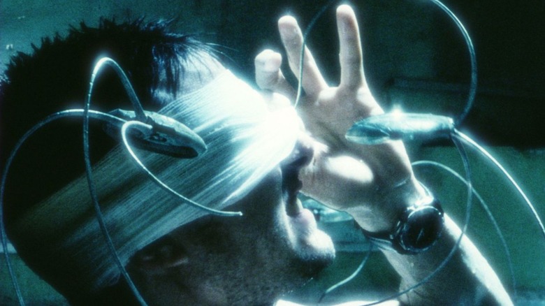 Chief John Anderton opening his bandage for a spider-bot in "Minority Report"