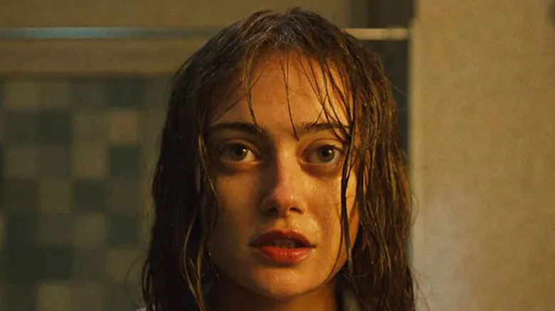 Rhiannon staring into the mirror with a bloody shirt on Sweetpea