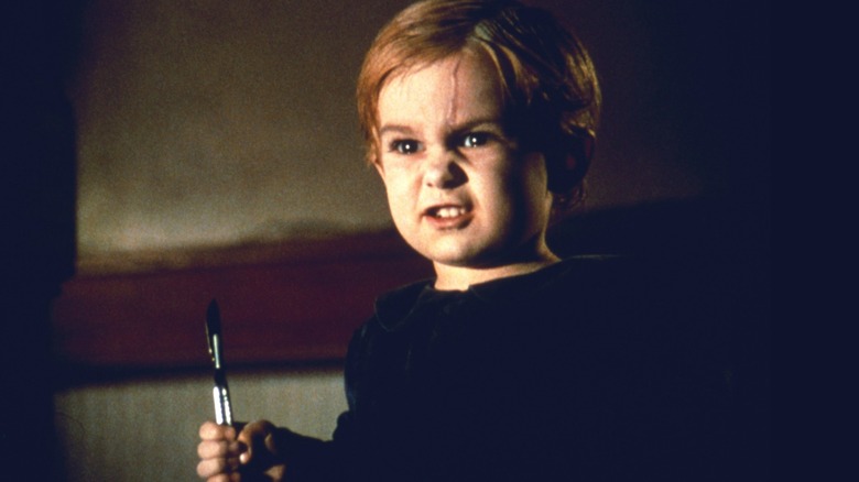 A reanimated Gage Creed wielding a scalpel in "Pet Sematary" (1989)