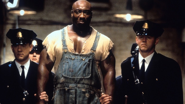 Paul and David walking beside John Coffey in "The Green Mile" (1999)