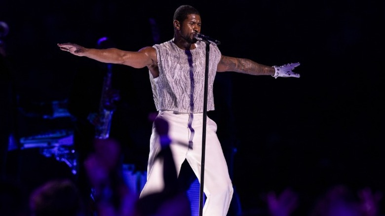 Usher performing on stage at the 2024 Super Bowl halftime show