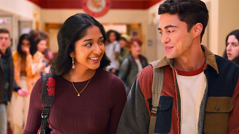 Devi and Paxton walking down the hall together in