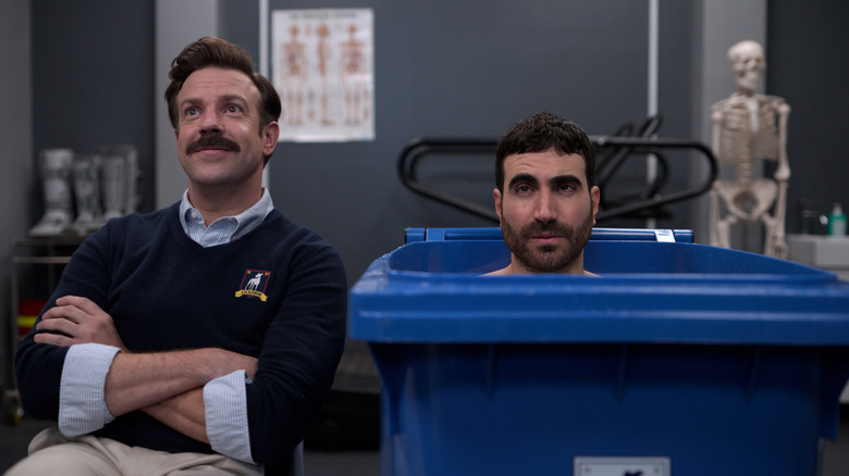 Ted sitting in the Richmond physical therapy room next to Roy taking an ice bath for sore muscles