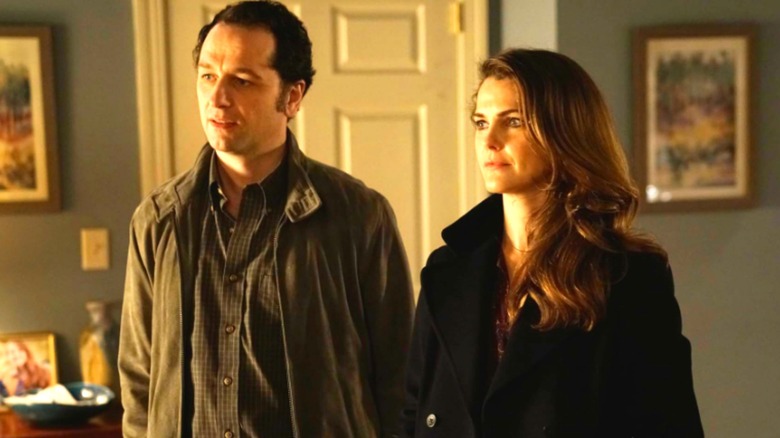 Elizabeth and Philip Jennings stand together in "The Americans" (2013-2018)