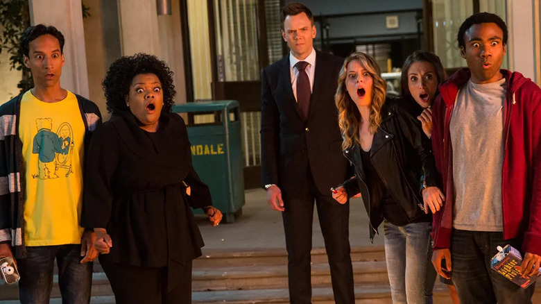 Abed Shirley Jeff Britta Annie and Troy outside school looking shocked on Community