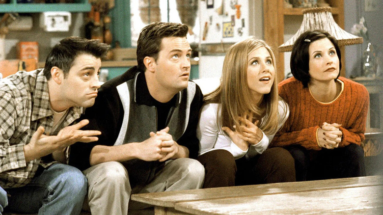 Joey Chandler Rachel and Monica on the couch looking up on Friends