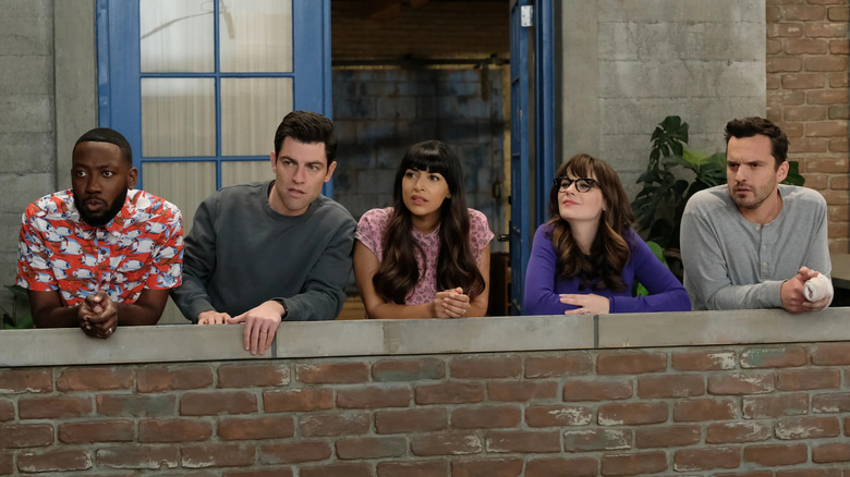 Winston Schmidt Cece Jess and Nick on a balcony looking out on New Girl