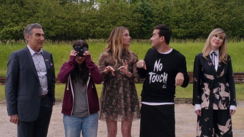 Johnny Stevie Alexis David and Moira outside of the motel on Schitt's Creek