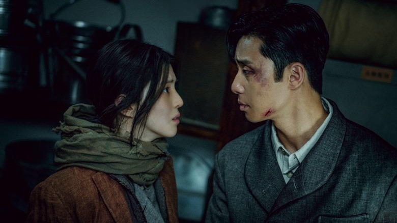 Chae-ok and a bruised Tae-sang stare at each other on "Gyeongseong Creature" (2023-2024)