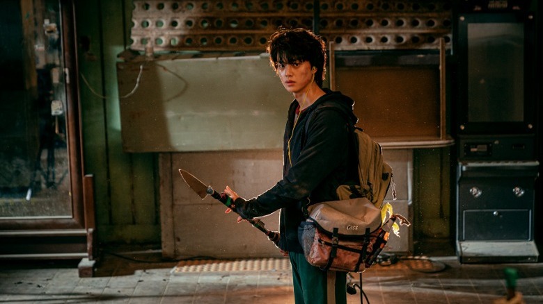 Hyun-su holding a makeshift spear on "Sweet Home" (2020-2024)