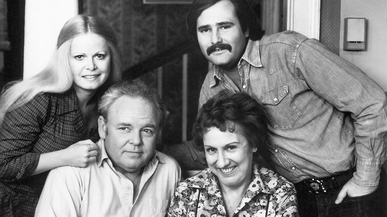 Archie and Edith Bunker pose for a photo with their kids on All in the Family