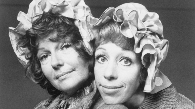 Rita Hayworth poses with Carol Burnett