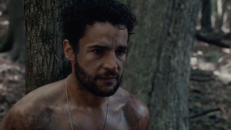 Will shirtless in front of a tree in It Comes at Night