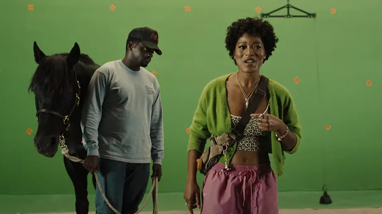 OJ a horse and Emerald on a film set in front of a green screen in Nope