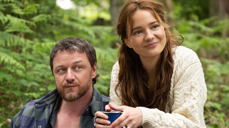 Paddy and Ciara sitting outside smiling weirdly in Speak No Evil