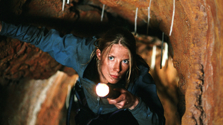 Sarah exploring the cave in The Descent
