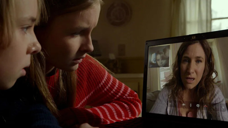 Tyler and Becca video-chatting with a worried Loretta in The Visit