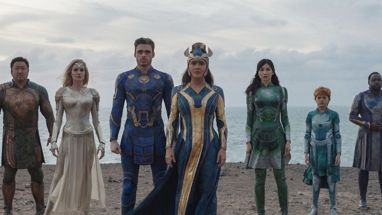 The Eternals gathered together on a beach in "Eternals"