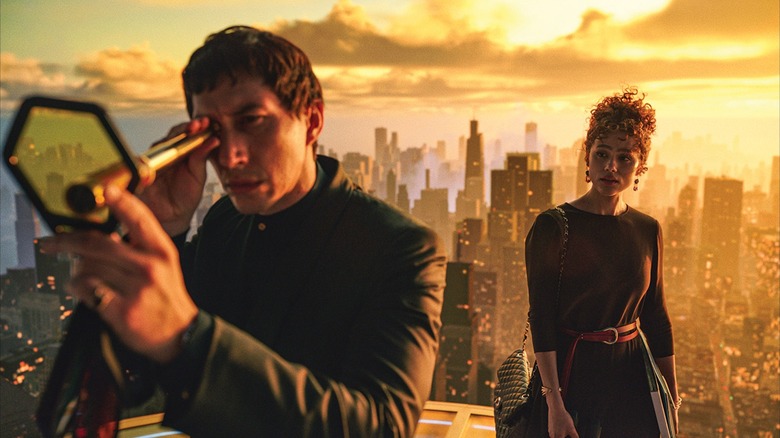 Cesar and Julia standing atop a building in "Megalopolis"