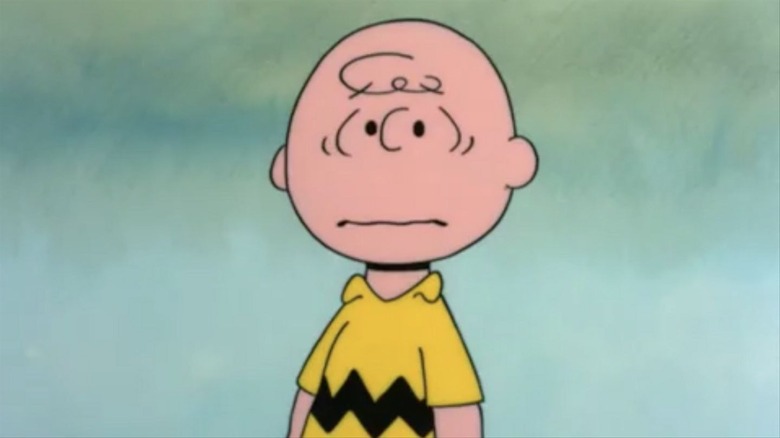 Charlie Brown scowling and sad
