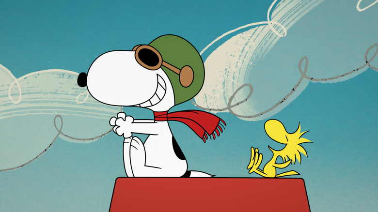 Woodstock on Snoopy's house laughing