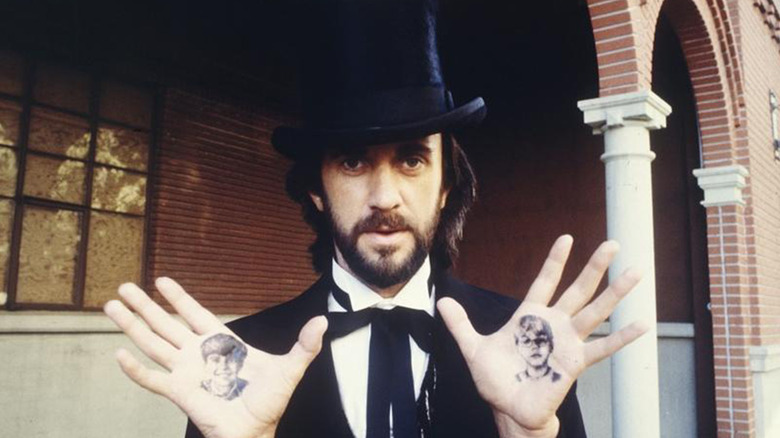 Mr. Dark presents his painted hands in 'Something Wicked This Way Comes' (1983)