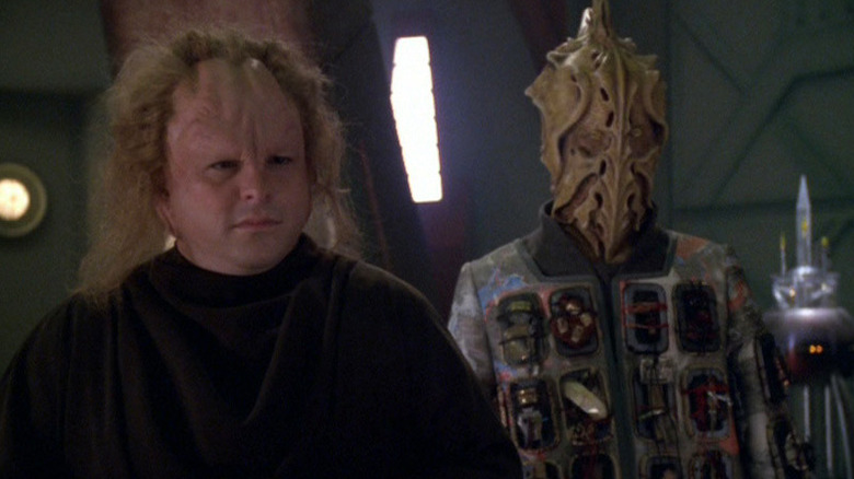 Two members of the Think Tank stand solemly in Star Trek: Voyager