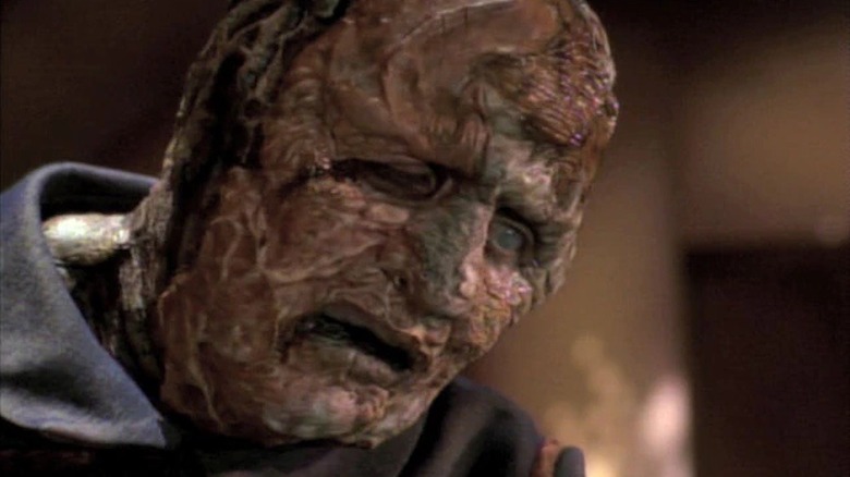 A Vidiian leans forward in Star Trek: Voyager