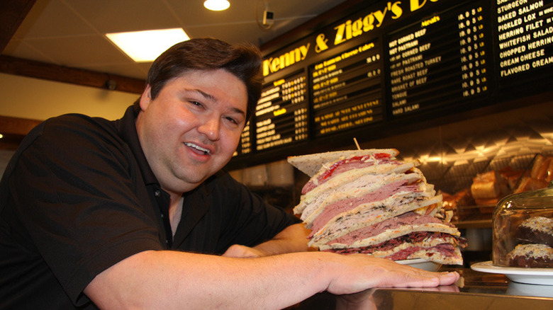a deli man and his giant sandwich 